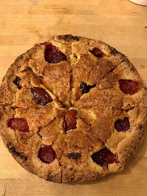 Plum cake on a wooden board
